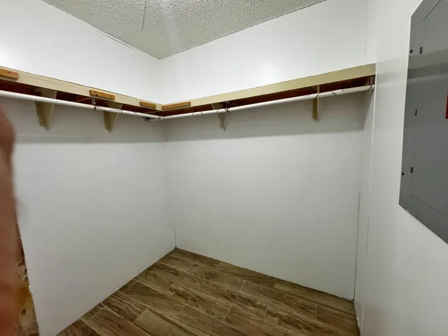 a view of a room with shelf on the wall