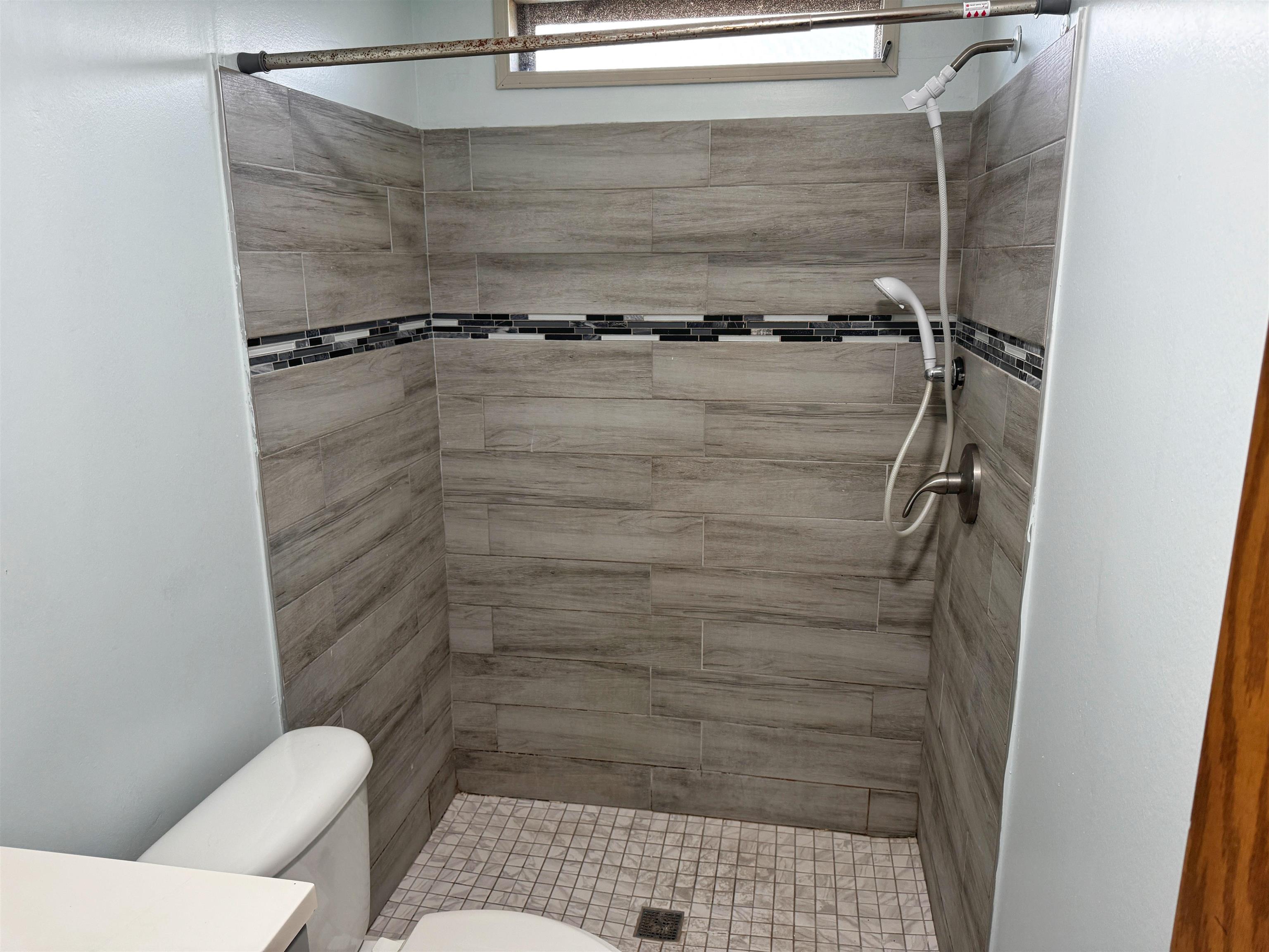 680 Coral Circle St. Augustine, FL 32080 - Photo 23 of 30 a bathroom with a shower