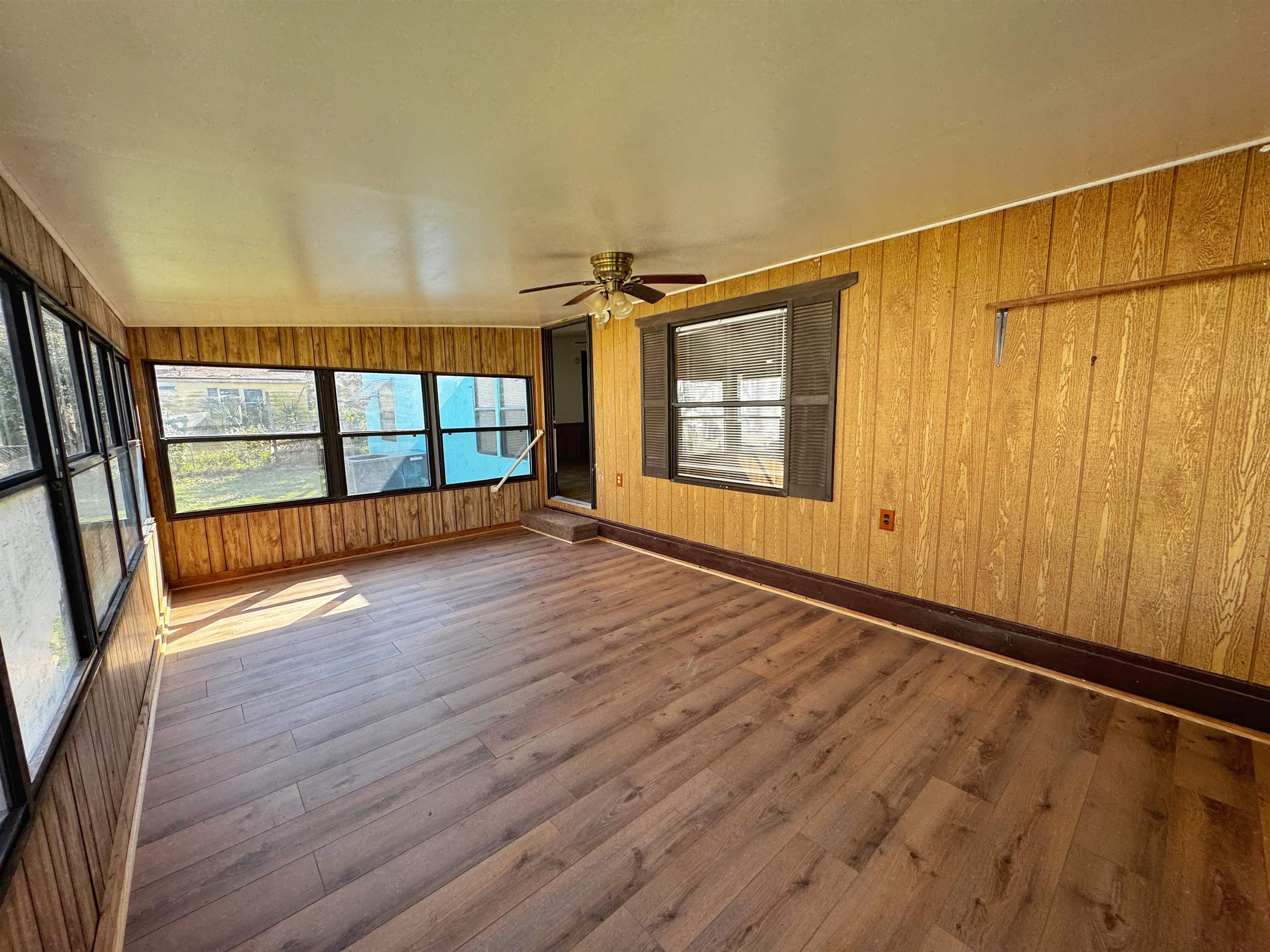 680 Coral Circle St. Augustine, FL 32080 - Photo 27 of 30 an empty room with wooden floor and windows