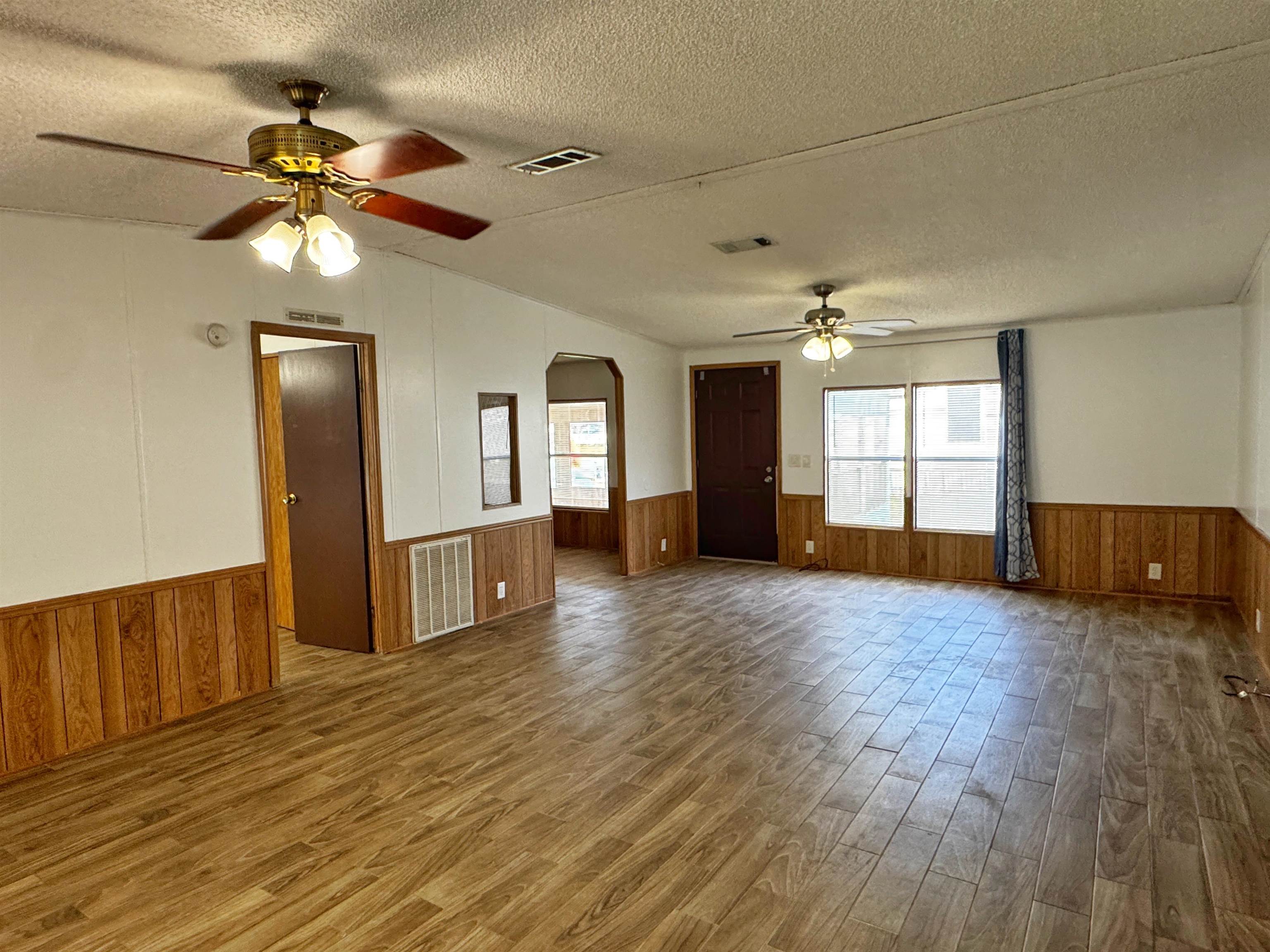 680 Coral Circle St. Augustine, FL 32080 - Photo 5 of 30 a view of an empty room with window and wooden floor