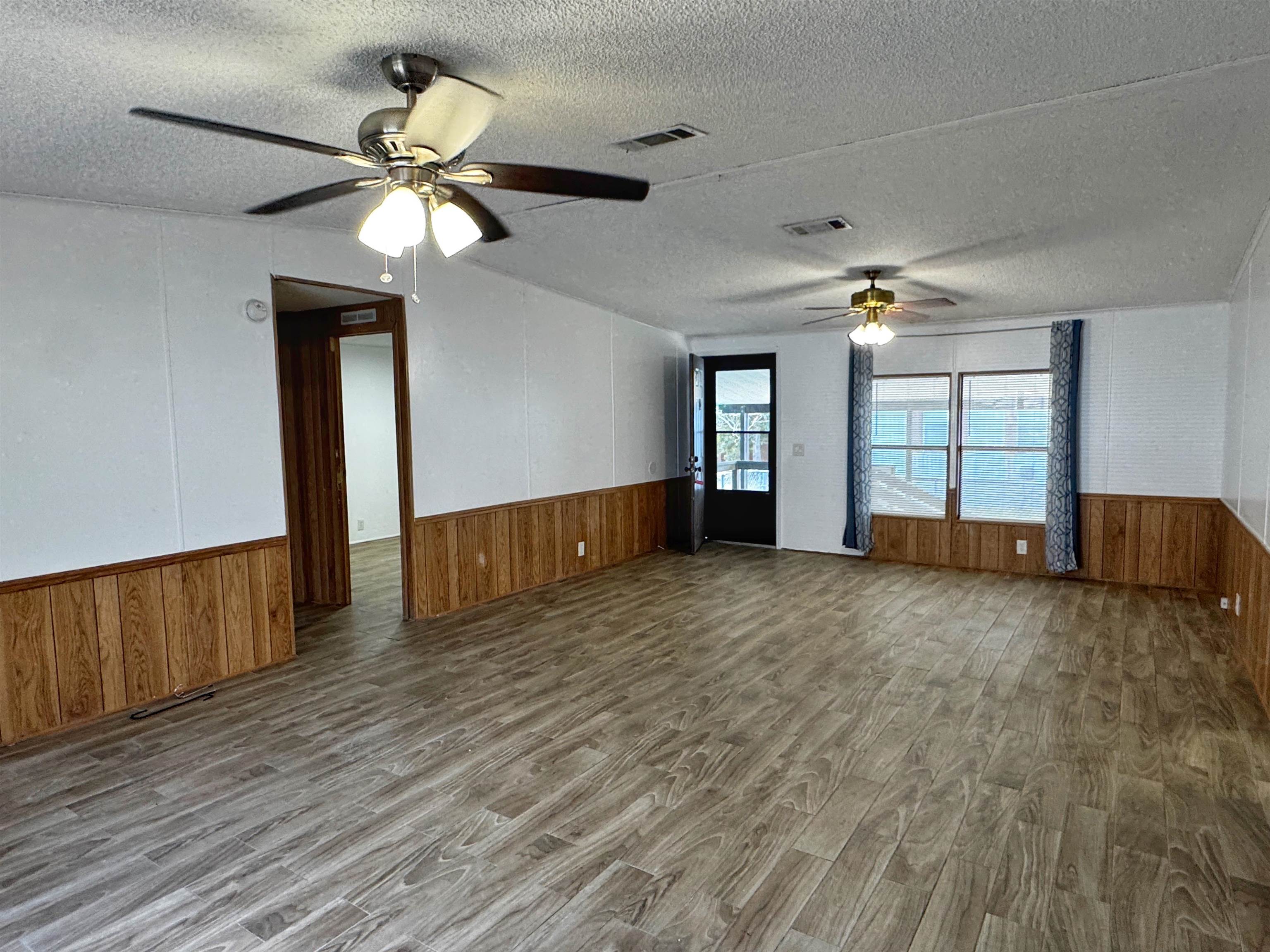 680 Coral Circle St. Augustine, FL 32080 - Photo 6 of 30 a view of empty room with wooden floor and fan