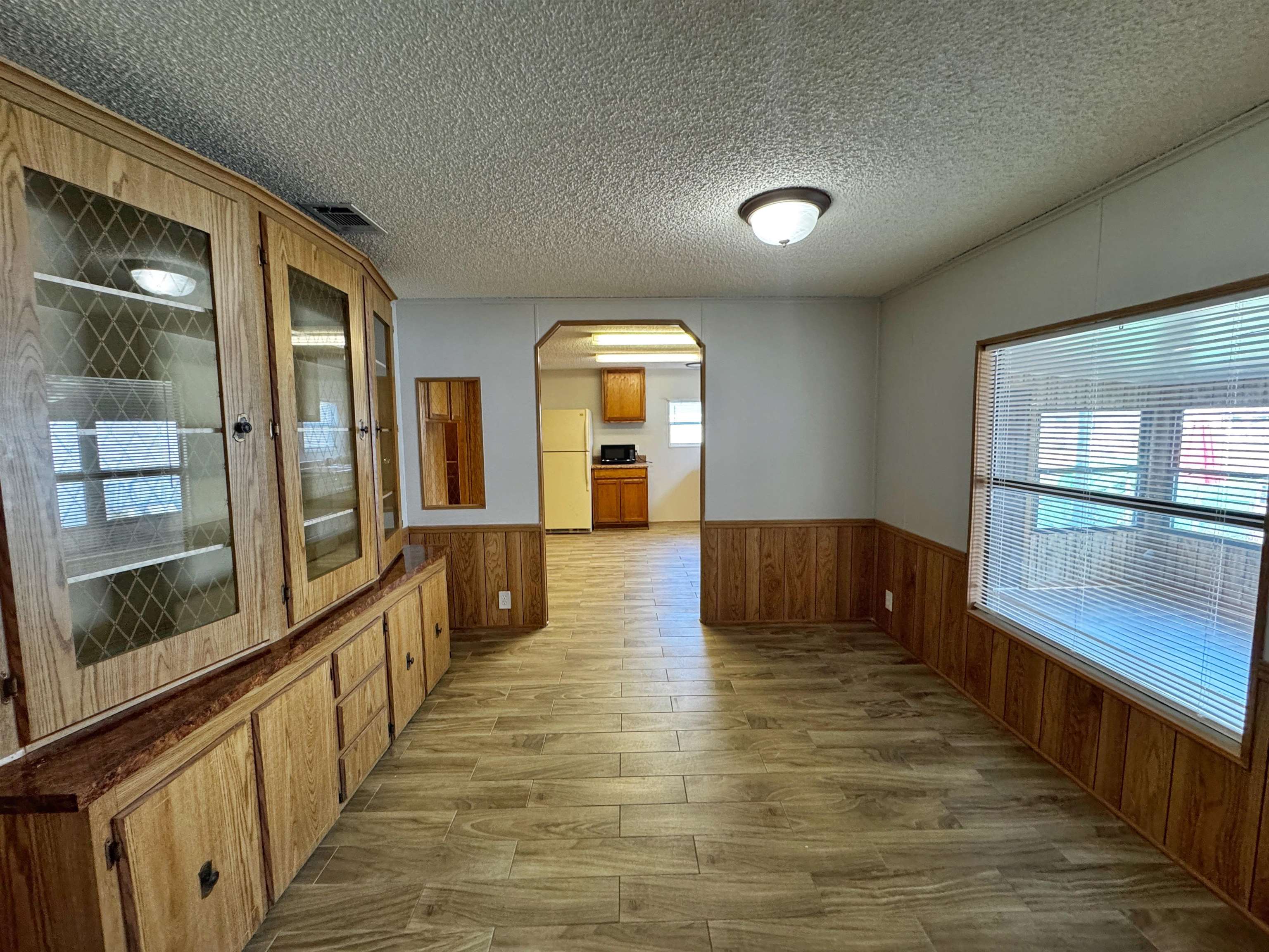 680 Coral Circle St. Augustine, FL 32080 - Photo 8 of 30 a view of a hallway with wooden floor and staircase