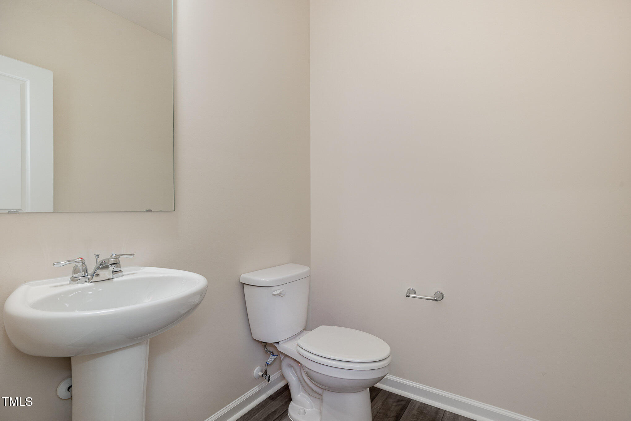 5706 Kalamata Drive Raleigh, NC 27603 - Photo 12 of 25 a bathroom with a sink and a toilet