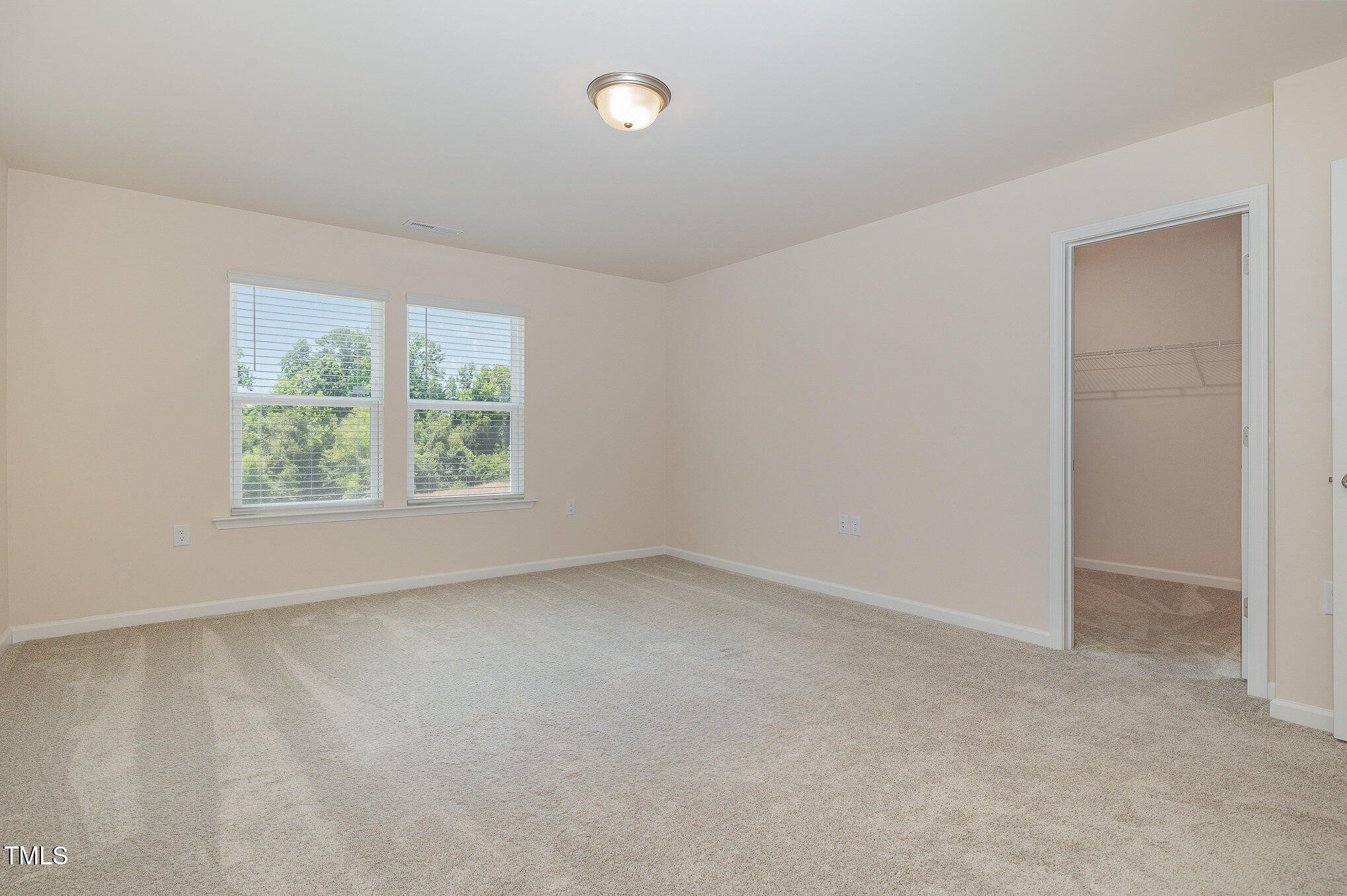 5706 Kalamata Drive Raleigh, NC 27603 - Photo 14 of 25 an empty room with windows