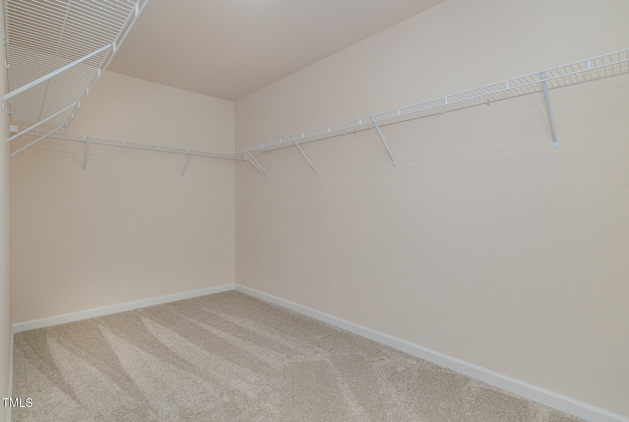 5706 Kalamata Drive Raleigh, NC 27603 - Photo 15 of 25 a view of a room with racks on the wall