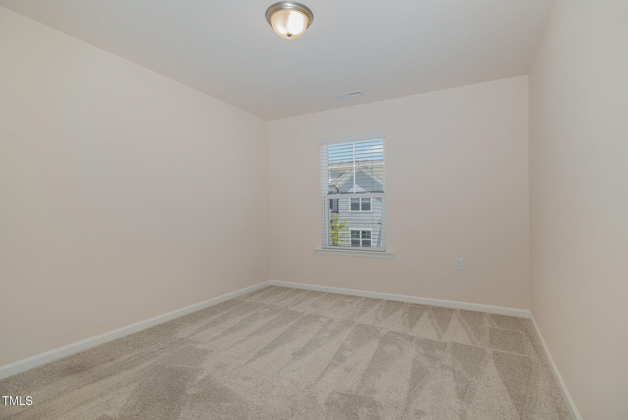 5706 Kalamata Drive Raleigh, NC 27603 - Photo 19 of 25 an empty room with a window