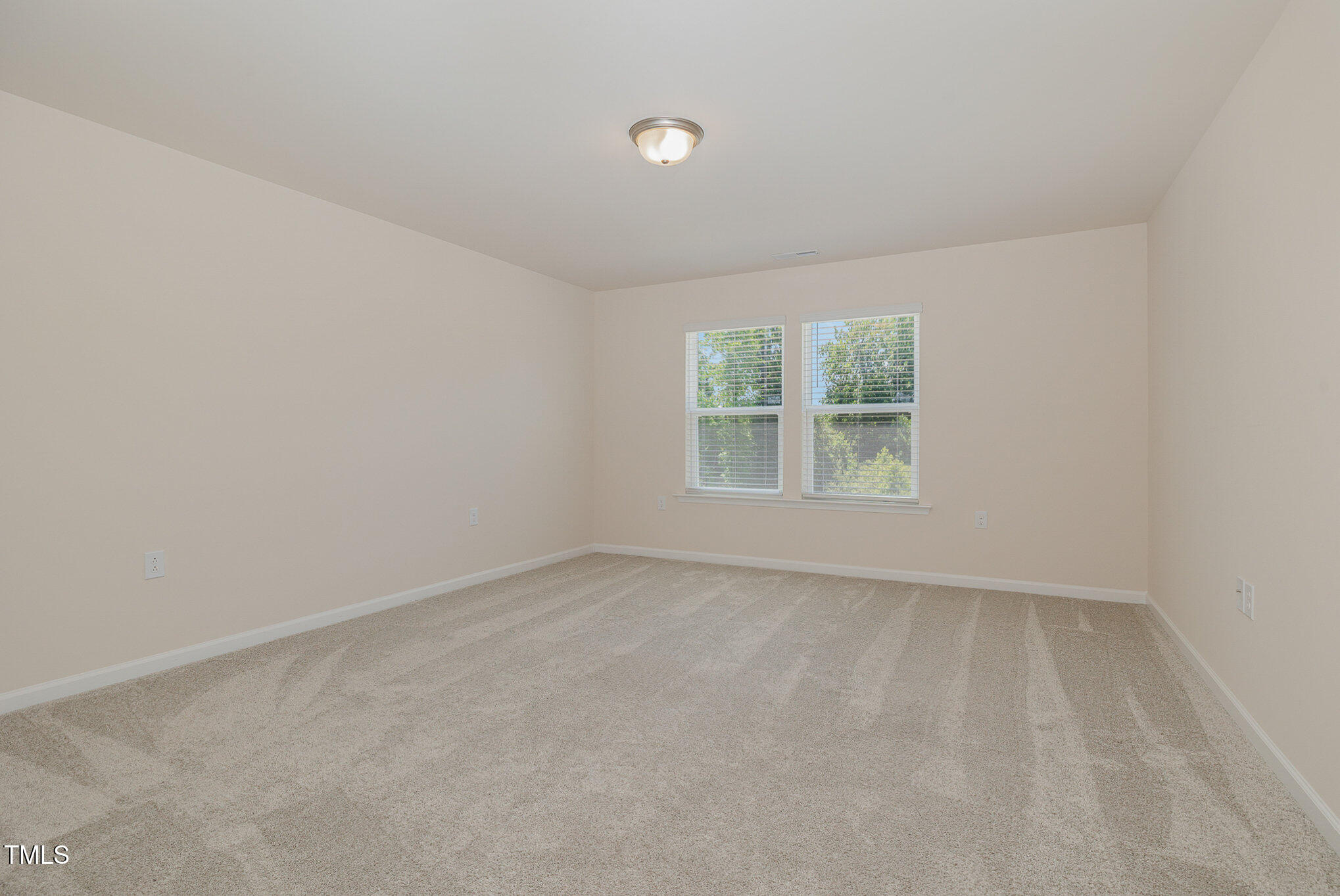 5706 Kalamata Drive Raleigh, NC 27603 - Photo 21 of 25 an empty room with windows