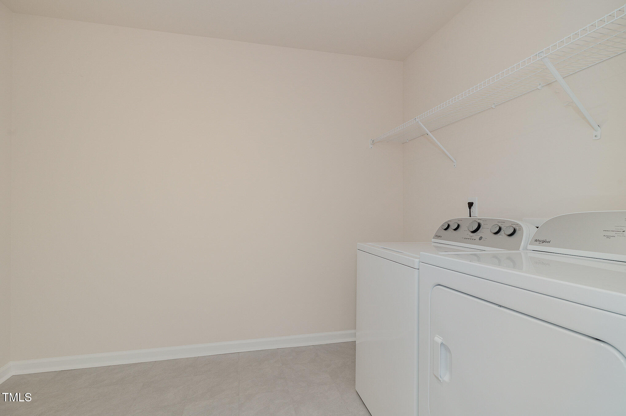 5706 Kalamata Drive Raleigh, NC 27603 - Photo 23 of 25 a utility room with dryer and washer