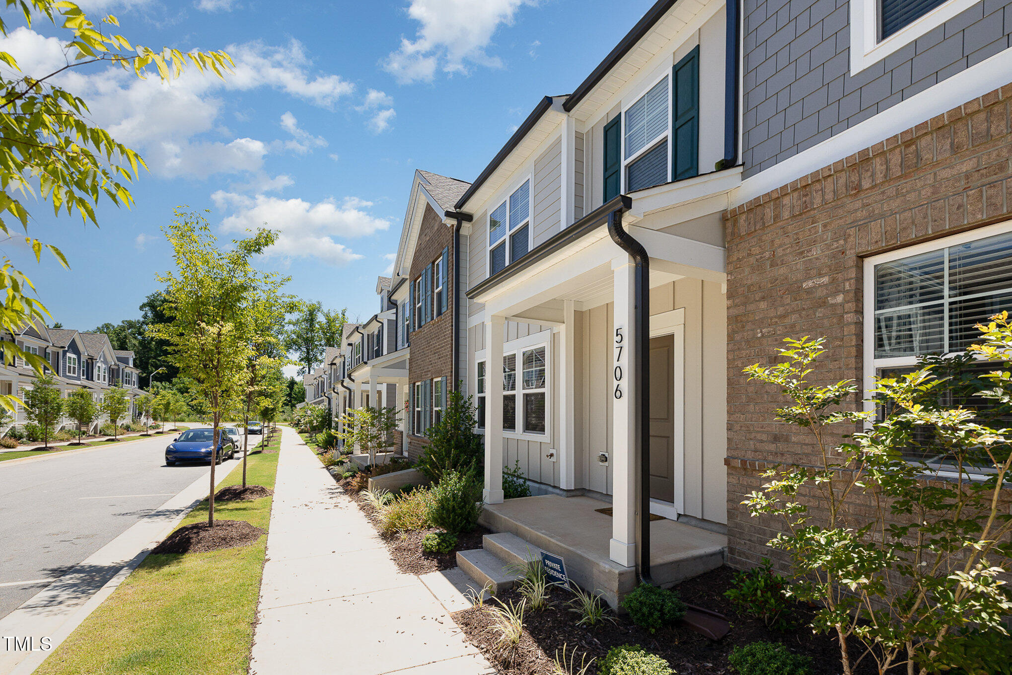 5706 Kalamata Drive Raleigh, NC 27603 - Photo 3 of 25 a view of a building with potted plants