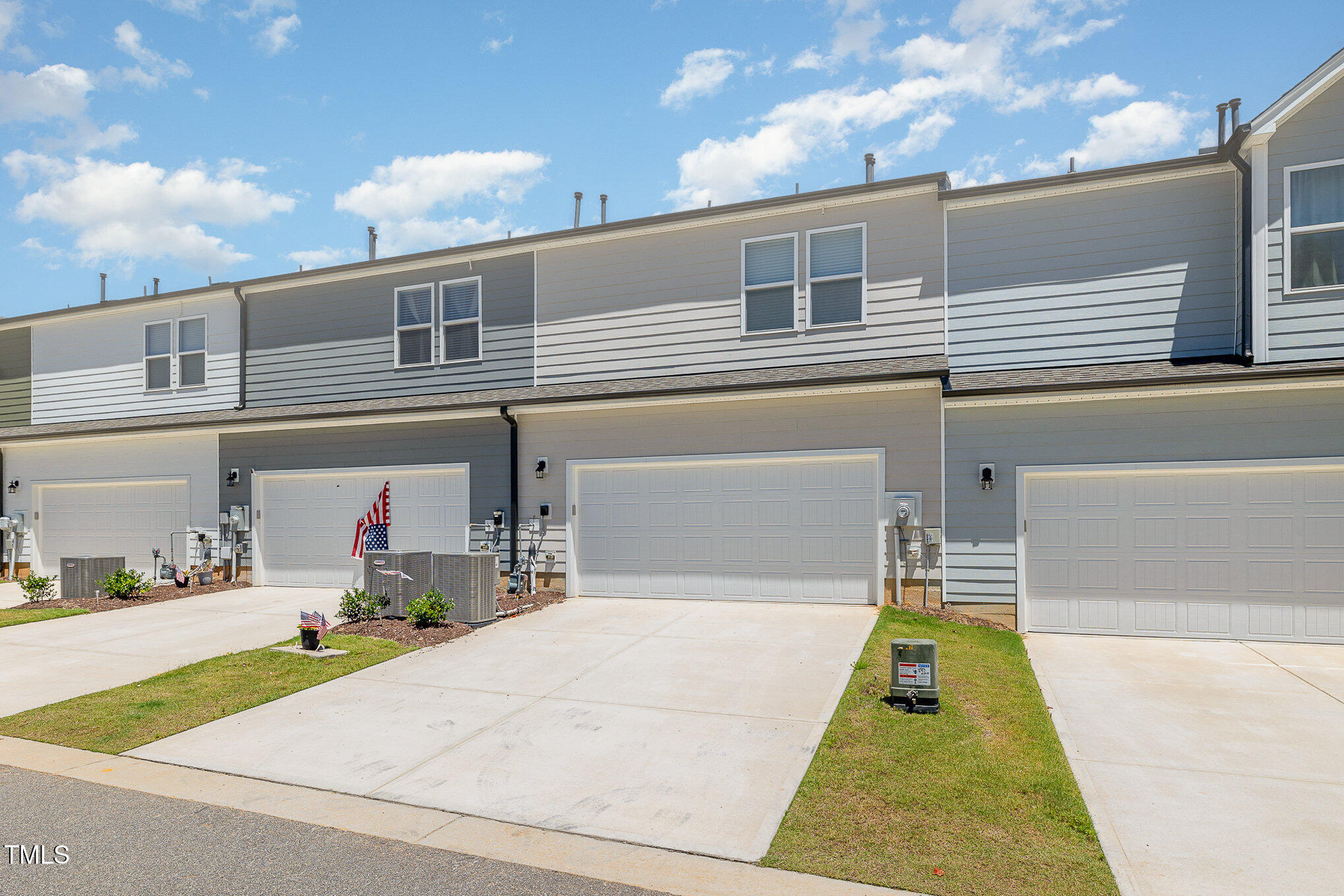 5706 Kalamata Drive Raleigh, NC 27603 - Photo 5 of 25 a front view of a house with a yard