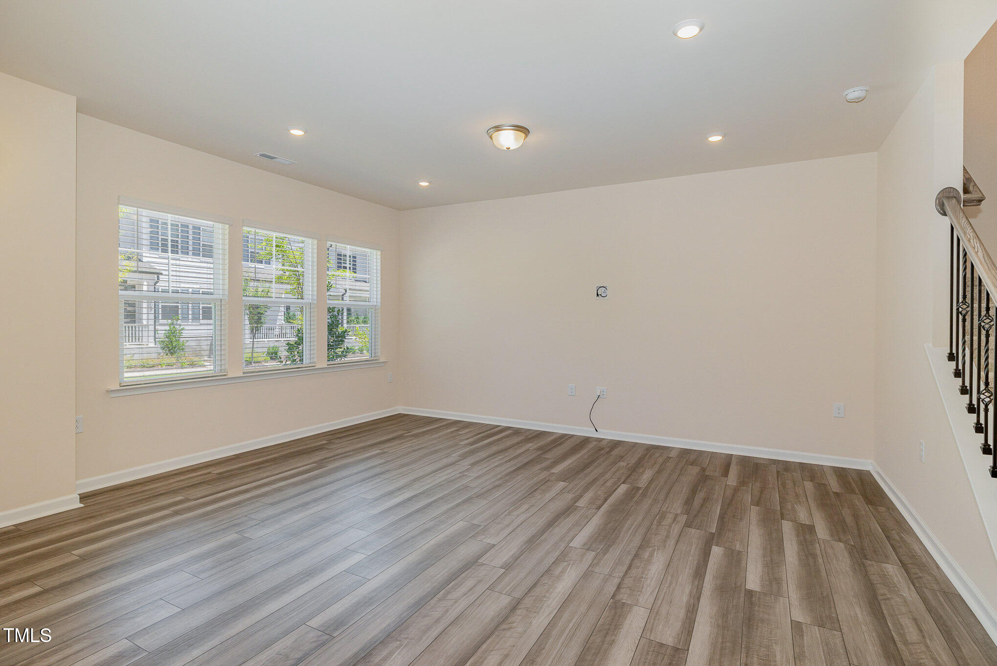 5706 Kalamata Drive Raleigh, NC 27603 - Photo 10 of 25 wooden floor in an empty room with a window
