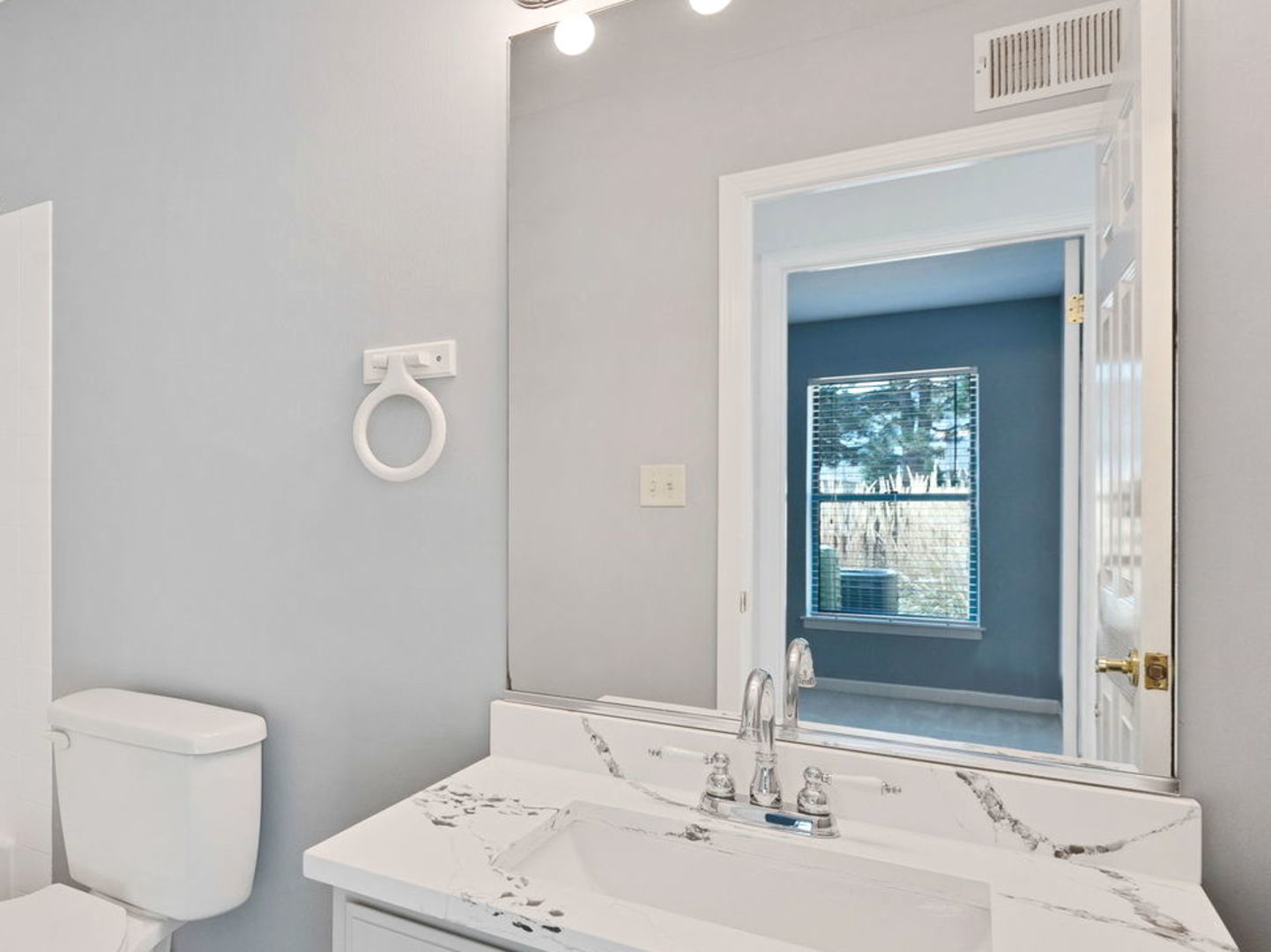 3265 Kirchoff Road, Unit 115 Rolling Meadows, IL 60008 - Photo 11 of 19 a bathroom with a sink mirror and toilet
