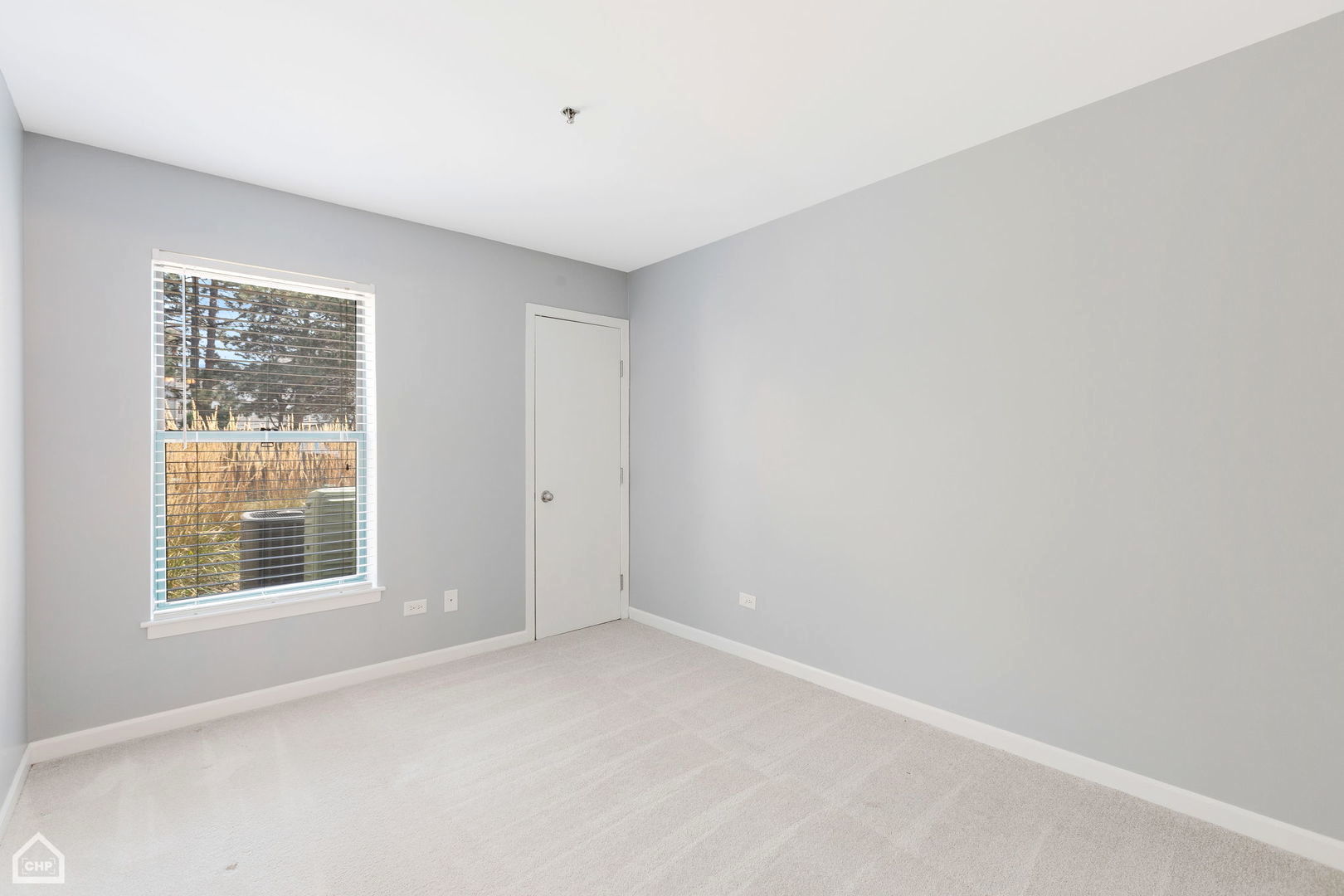 3265 Kirchoff Road, Unit 115 Rolling Meadows, IL 60008 - Photo 12 of 19 an empty room with a window