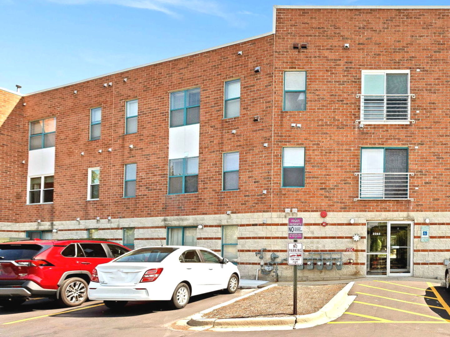 3265 Kirchoff Road, Unit 115 Rolling Meadows, IL 60008 - Photo 15 of 19 a cars parked in front of a building