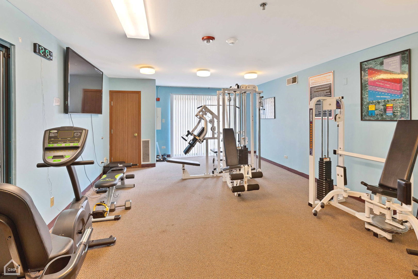 3265 Kirchoff Road, Unit 115 Rolling Meadows, IL 60008 - Photo 17 of 19 a view of a room with gym equipment