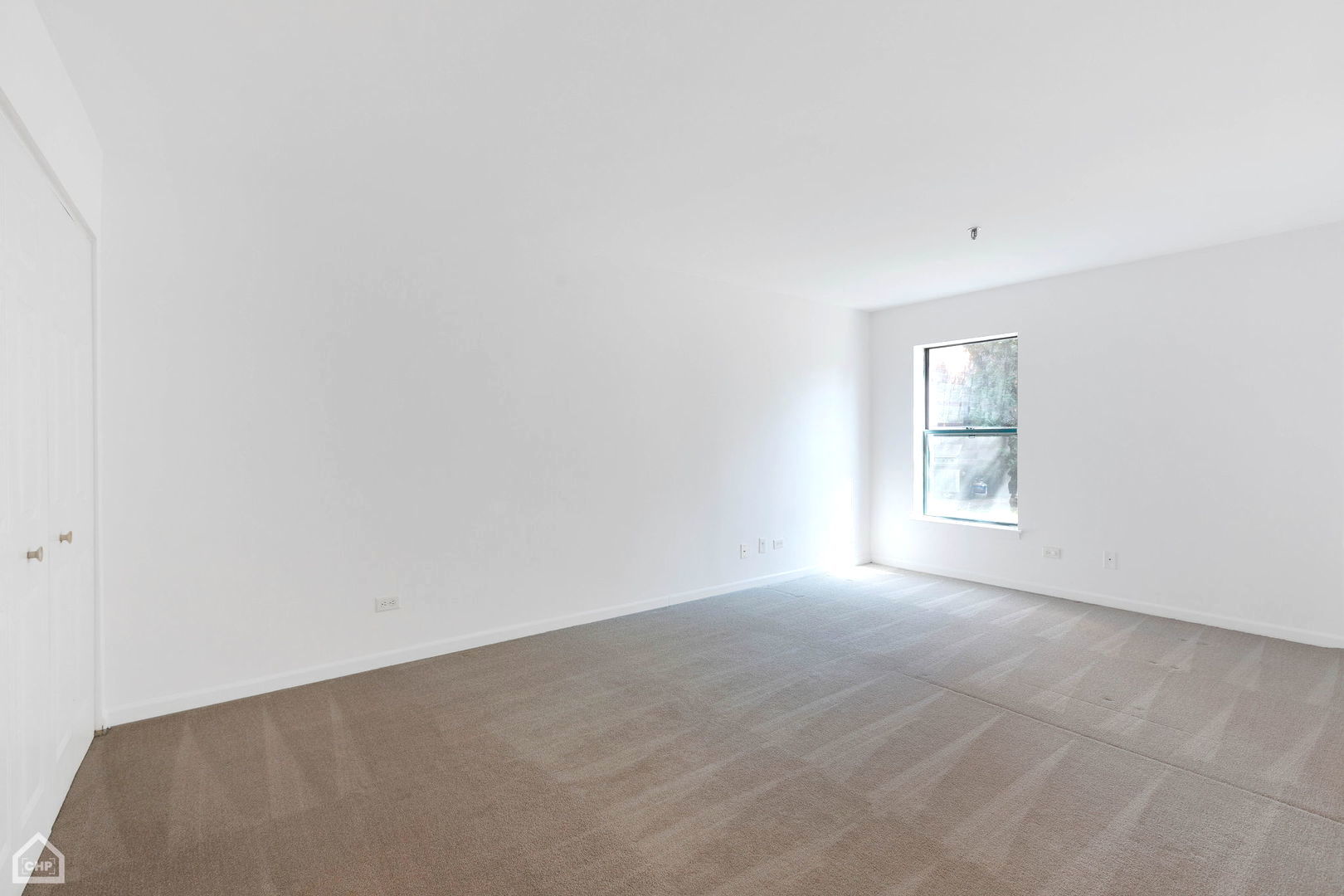 3265 Kirchoff Road, Unit 115 Rolling Meadows, IL 60008 - Photo 9 of 19 an empty room with windows