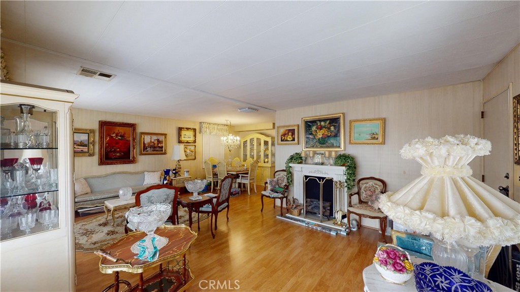14851 Jeffrey Road, Unit 117 Irvine, CA 92618 - Photo 11 of 45 a living room with furniture and a fireplace