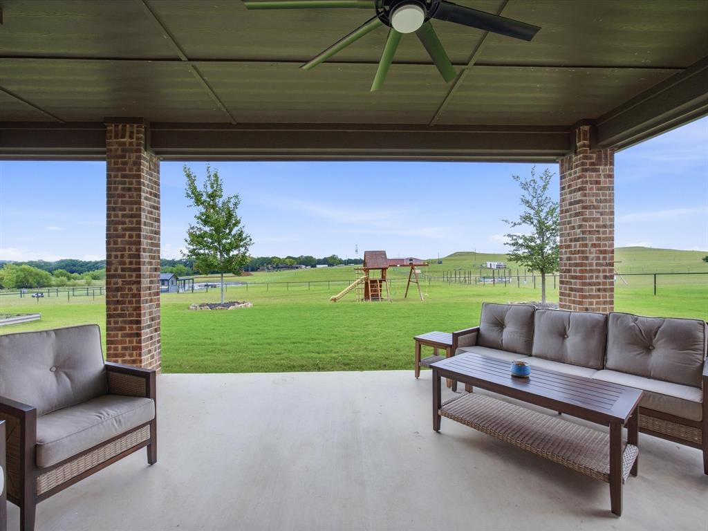 150 Quail Ridge Decatur, TX 76234 - Photo 32 of 32 a view of a porch with furniture and a yard