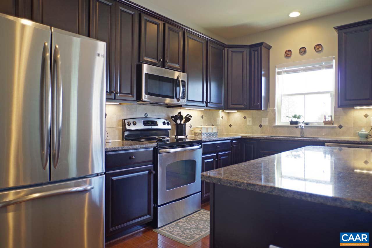 5424 Park Road Crozet, VA 22932 - Photo 14 of 50 a kitchen with granite countertop a refrigerator stove and microwave