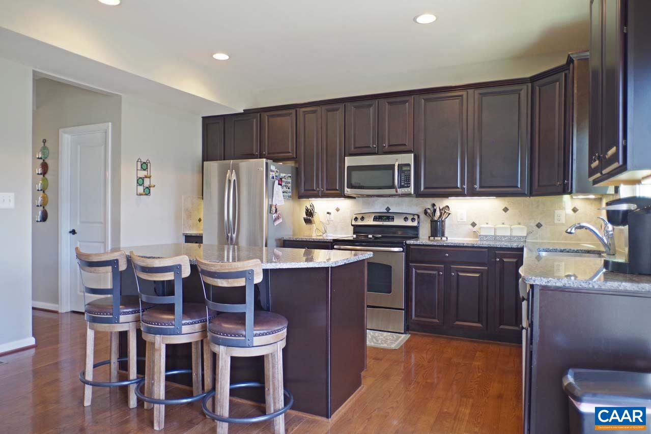 5424 Park Road Crozet, VA 22932 - Photo 15 of 50 a kitchen with wooden cabinets and stainless steel appliances