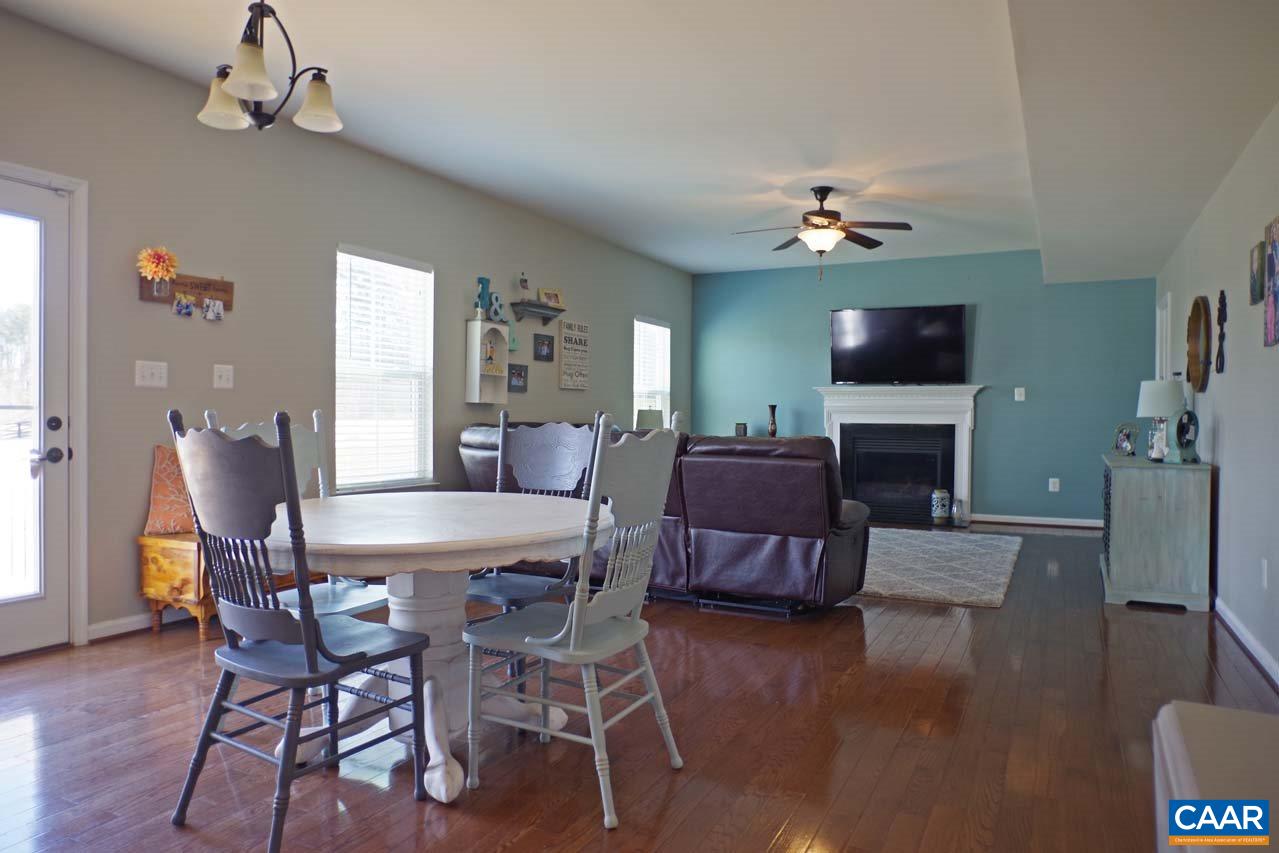 5424 Park Road Crozet, VA 22932 - Photo 17 of 50 a view of a dining room with furniture a chandelier and wooden floor