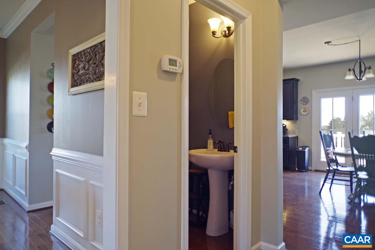 5424 Park Road Crozet, VA 22932 - Photo 22 of 50 a view of a hallway with furniture and wooden floor