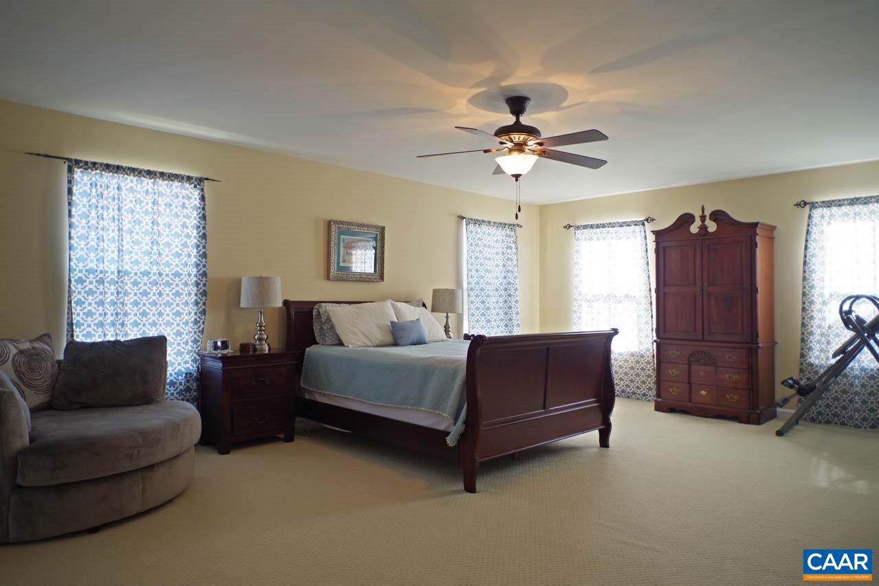 5424 Park Road Crozet, VA 22932 - Photo 24 of 50 a living room with furniture a ceiling fan and a window
