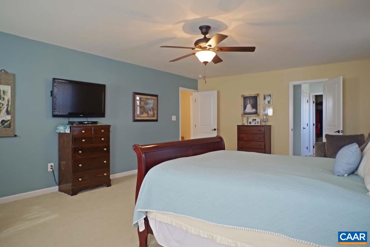 5424 Park Road Crozet, VA 22932 - Photo 25 of 50 a bedroom with a bed and a flat screen tv