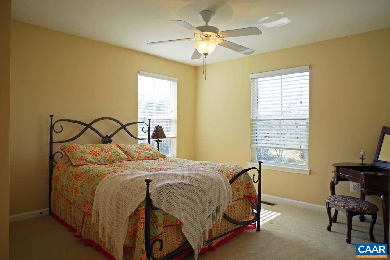 5424 Park Road Crozet, VA 22932 - Photo 38 of 50 a bedroom with a bed and a table in it
