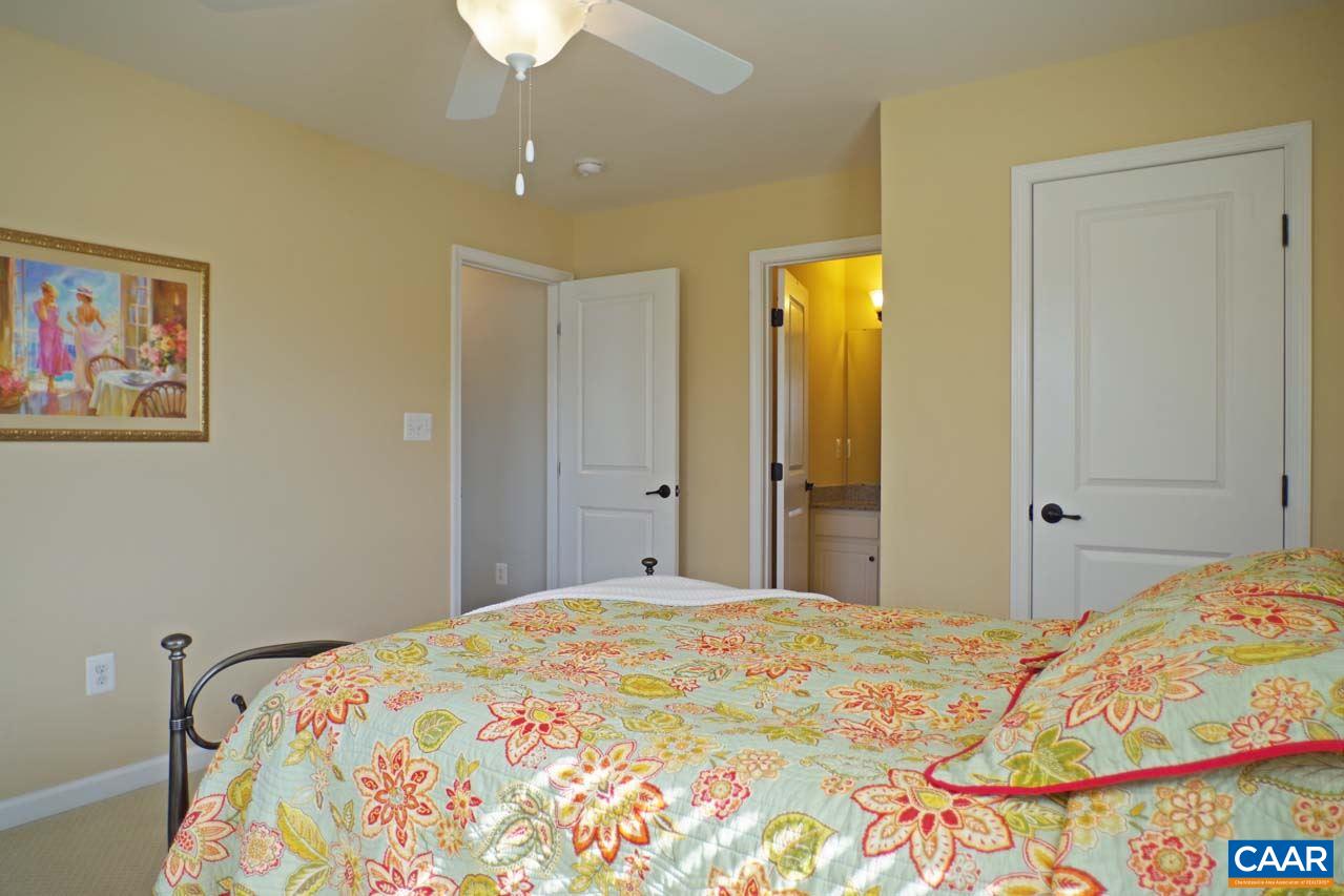 5424 Park Road Crozet, VA 22932 - Photo 39 of 50 a bedroom with a bed and a chandelier