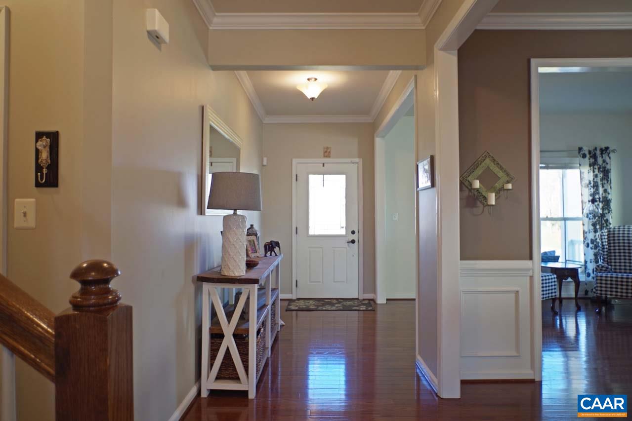 5424 Park Road Crozet, VA 22932 - Photo 4 of 50 a view of a hallway with wooden floor and stairs