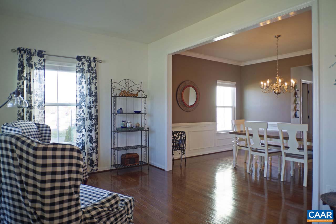 5424 Park Road Crozet, VA 22932 - Photo 6 of 50 a view of a livingroom with furniture wooden floor a chandelier and windows