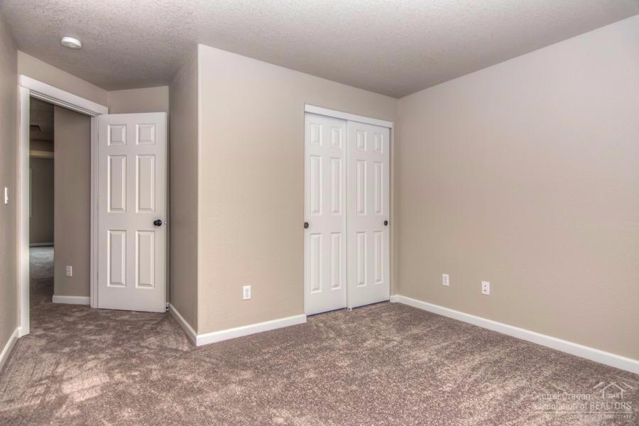 20872 Daniel Duke Way Bend, OR 97701 - Photo 20 of 21 Second bedroom looking toward hallway