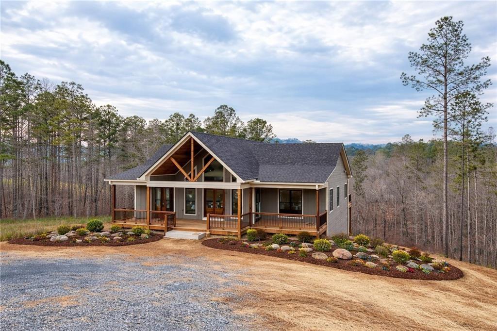 2956 Blalock Mountain Road Talking Rock, GA 30175 - Photo 55 of 63 a front view of a house with a yard
