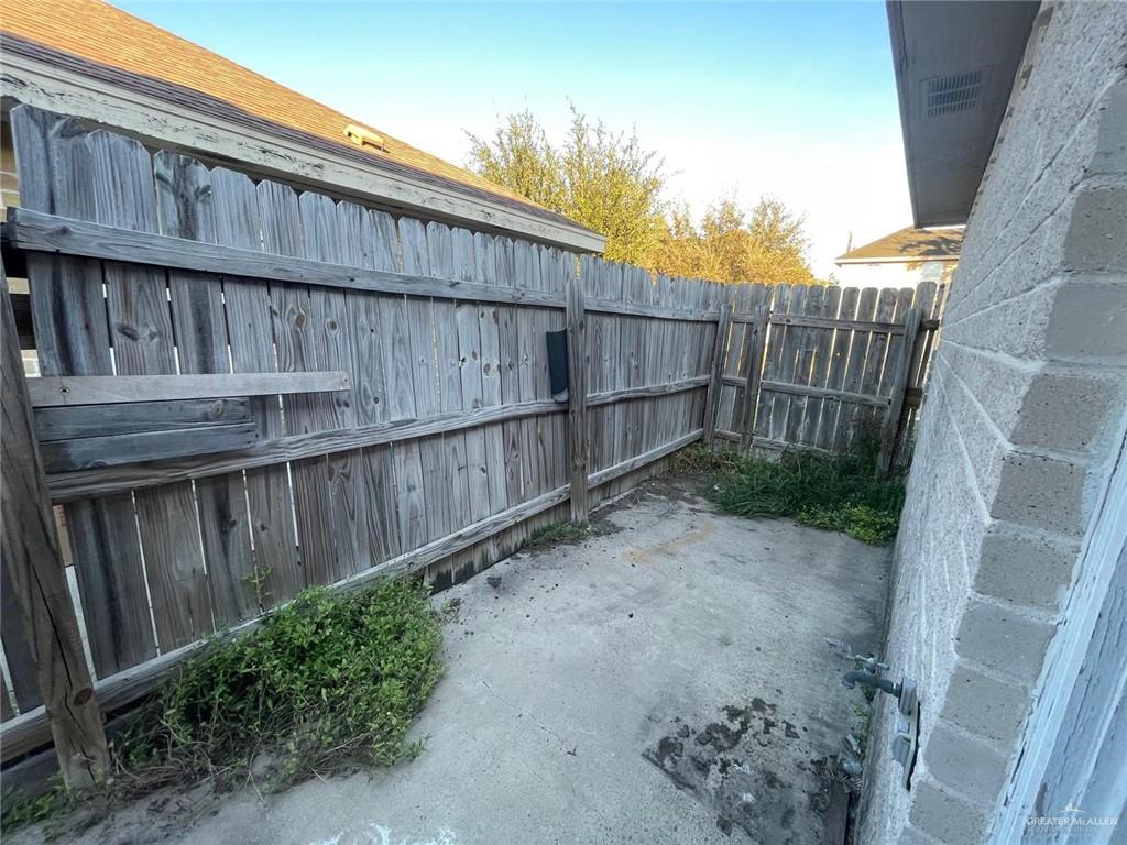 1413 Nassau Street, Unit A Edinburg, TX 78541 - Photo 3 of 9 a view of a backyard with wooden fence