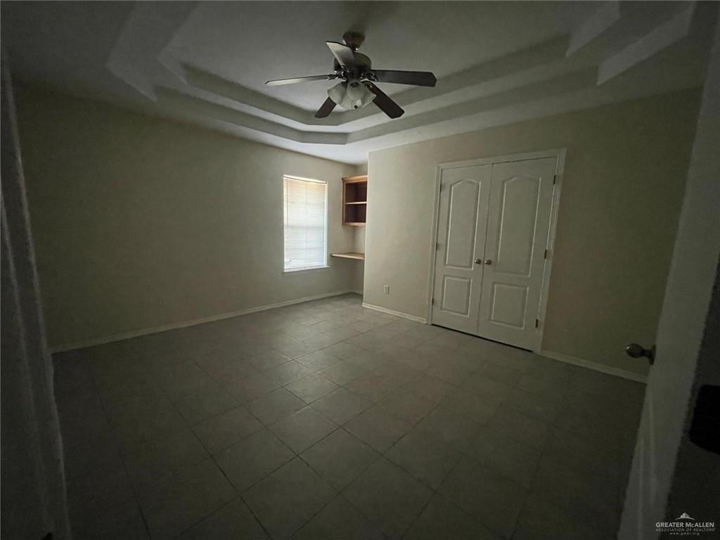 1413 Nassau Street, Unit A Edinburg, TX 78541 - Photo 4 of 9 a view of a livingroom with a ceiling fan & windows