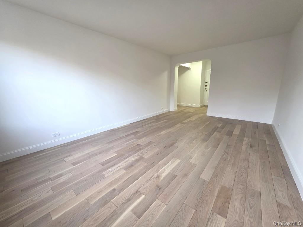 35-21 79th Street, Unit 4M Queens, NY 11372 - Photo 2 of 11 a view of an empty room and wooden floor