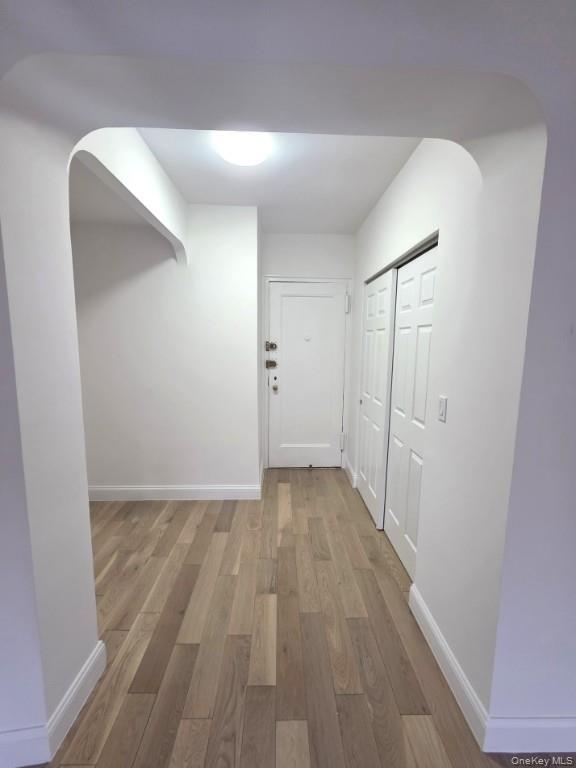 35-21 79th Street, Unit 4M Queens, NY 11372 - Photo 3 of 11 a view of a hallway with wooden floor