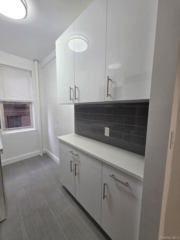 35-21 79th Street, Unit 4M Queens, NY 11372 - Photo 5 of 11 a bathroom with a sink and a mirror