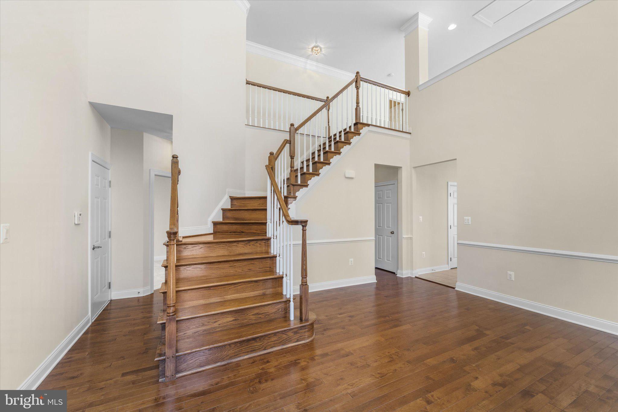 22990 Weybridge Square Ashburn, VA 20148 - Photo 14 of 66 Hardwood Stairs to Upper Level