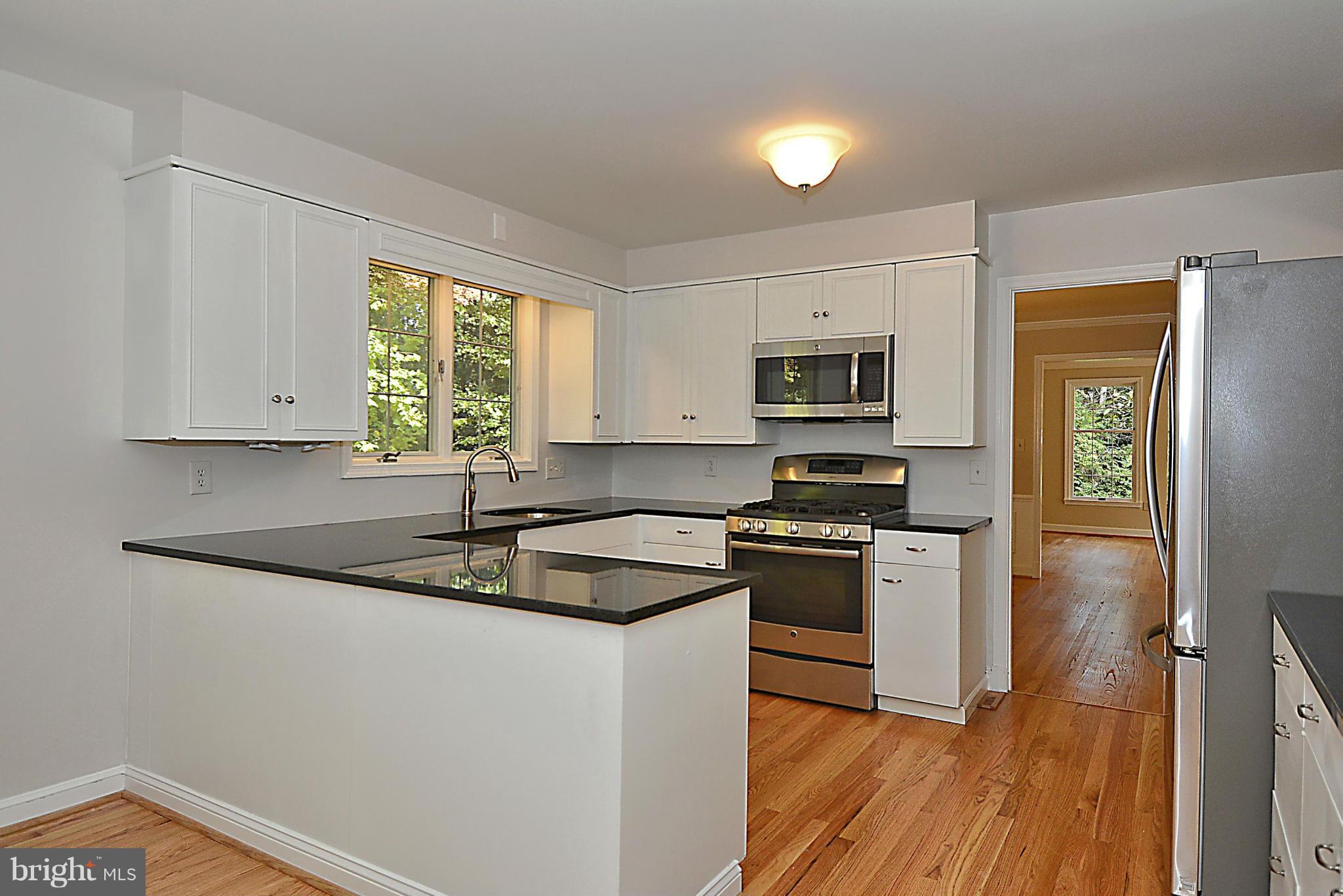 316 East Ridgely Road Lutherville-Timonium, MD 21093 - Photo 8 of 30 Kitchen with new wood floors and granite counters