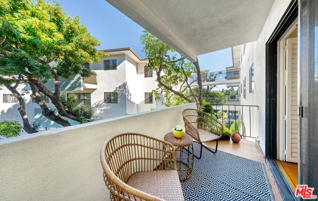 a view of balcony with furniture
