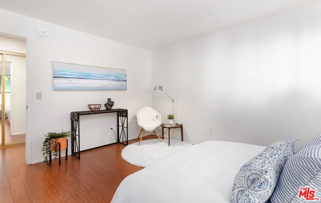 a bedroom with a bed and a table