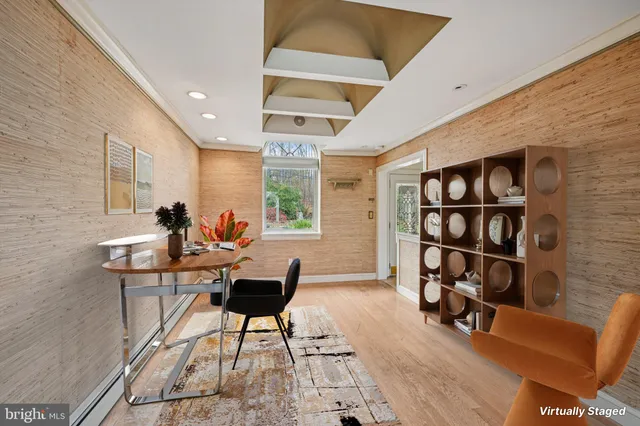 a work room with furniture and a bookshelf