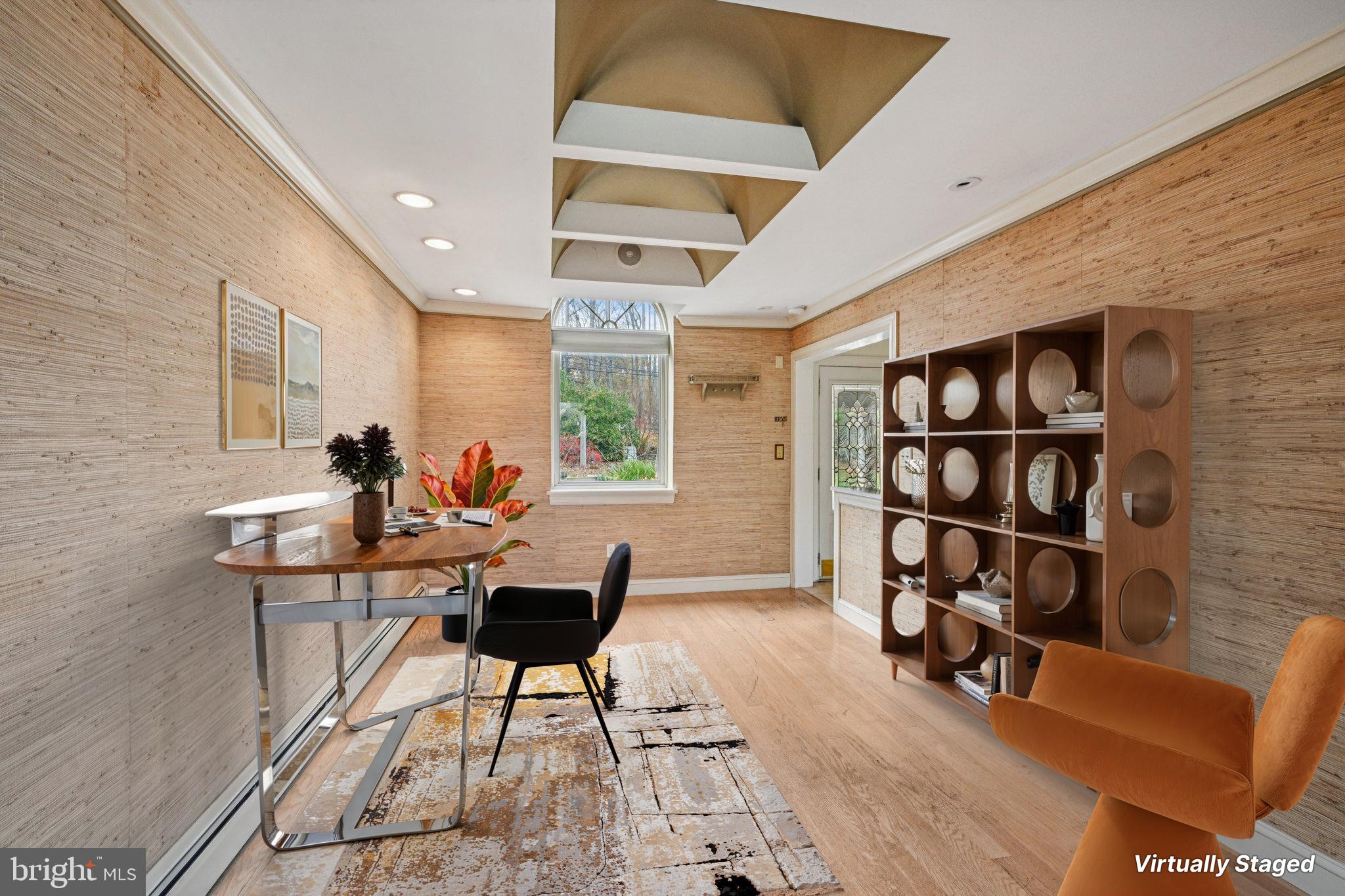 1607 Silverside Road Wilmington, DE 19810 - Photo 12 of 36 a work room with furniture and a bookshelf