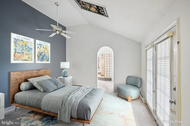 a bedroom with bed and a window