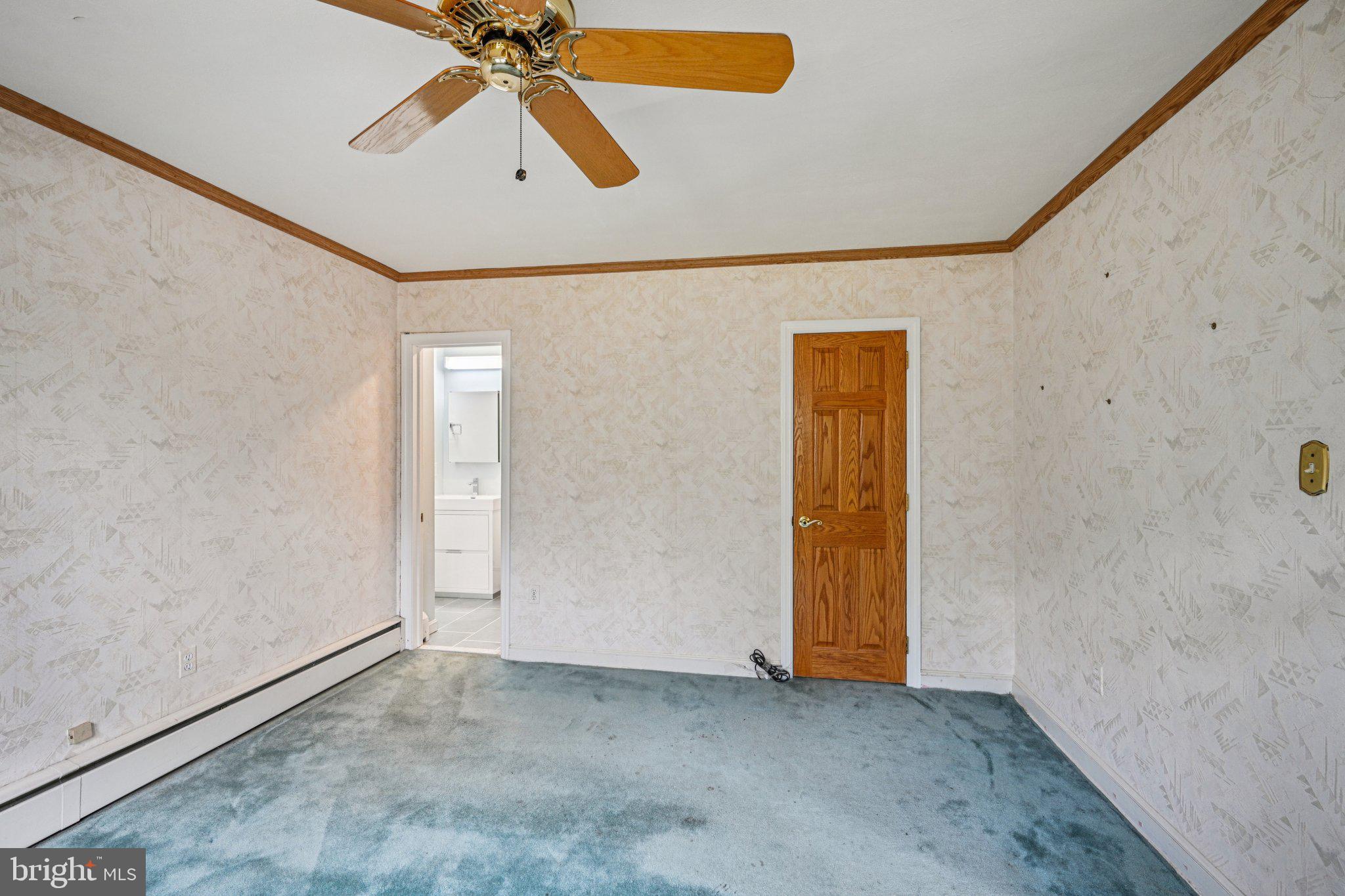 1607 Silverside Road Wilmington, DE 19810 - Photo 27 of 36 an empty room with closet and a chandelier fan
