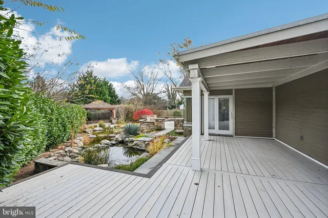 a view of a white house with a yard