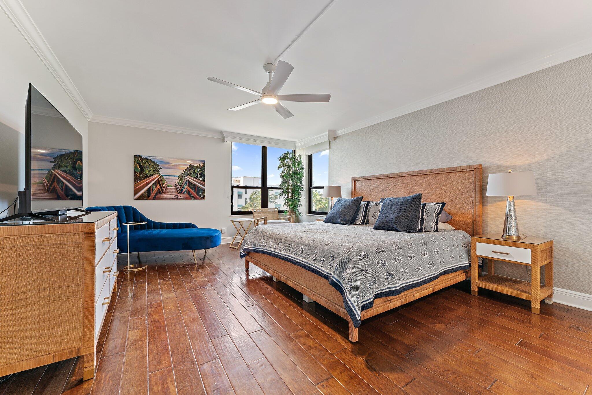 19670 South Beach Road, Unit B303 Jupiter, FL 33469 - Photo 31 of 104 a bedroom with a bed and a wooden floor