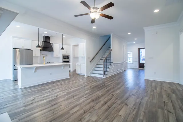 a view of kitchen with cabinets and wooden floor